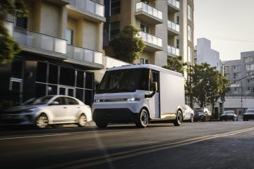Front 3/4 view of the 2025 Chevrolet BrightDrop 400 driving through a city.